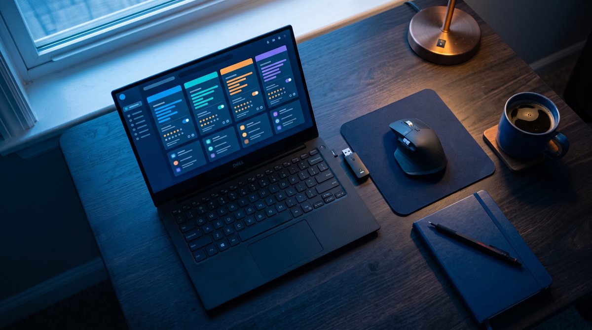 Mouse jiggler software options compared on a Windows laptop screen on a home-office desk